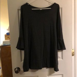 Gray top with bell sleeved.